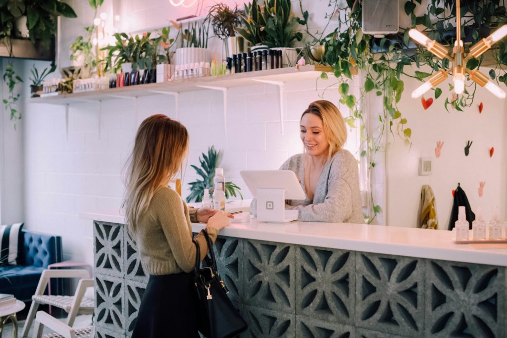 A customer at the counter with a cashier.