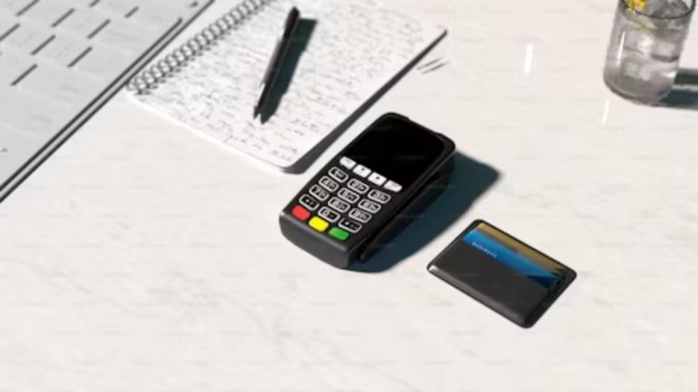 Card and payment terminal on desk